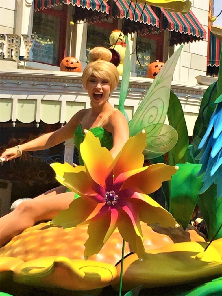 Tinkerbell hanging out on her float in Magic Kingdom