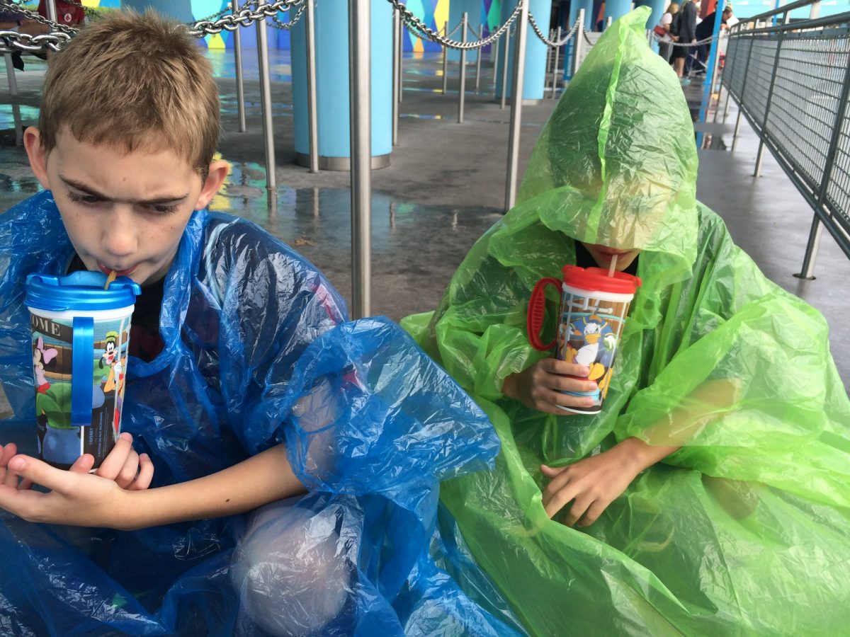 Waiting in line for the buses, while wearing our ponchos
