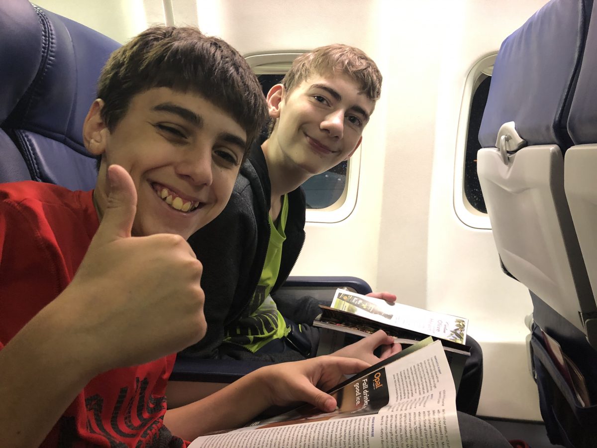 Boys sitting on an airplane, waiting for take off