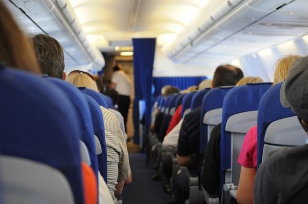 Passengers sit on an airplane