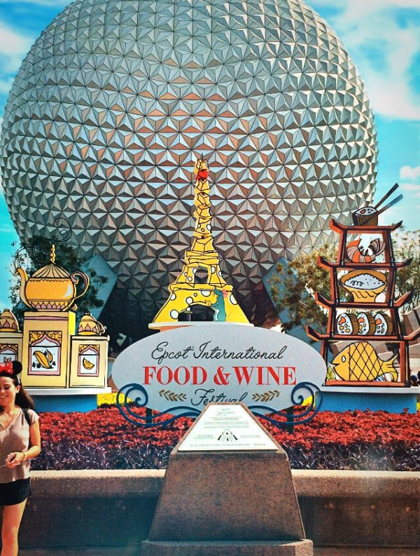 Epcot International Food and Wine Festival sign in front of Spaceship Earth