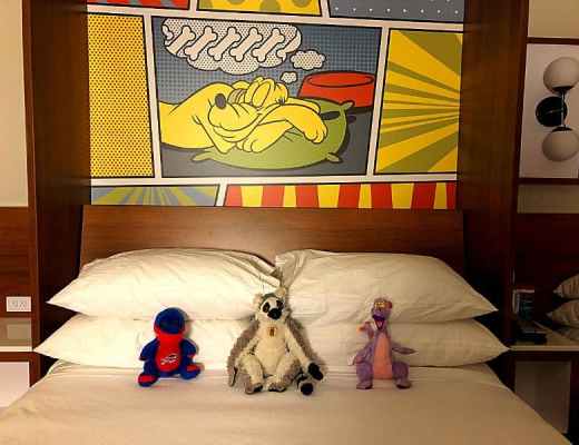 stuffed animals on the bed at Pop Century
