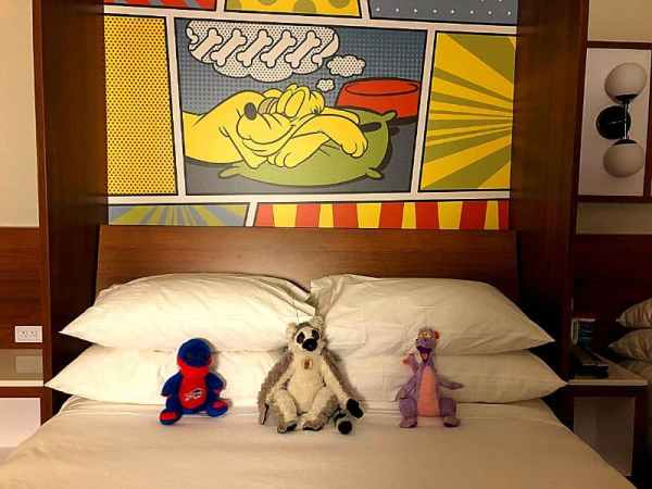 stuffed animals on the bed at Pop Century