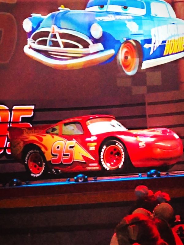 Lightning McQueen racing his way to the finish line at Lightning McQueen's Racing Academy in Disney's Hollywood Studios