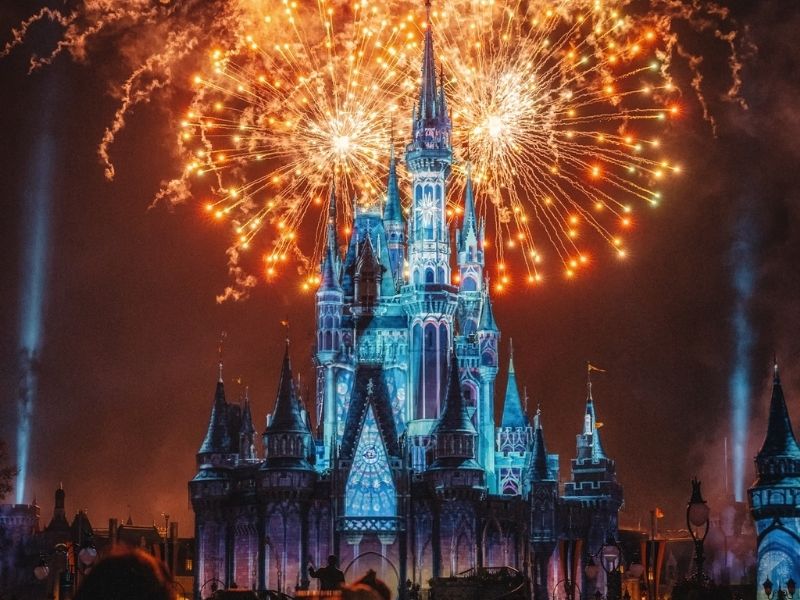 Cinderella Castle colored by projections and fireworks
