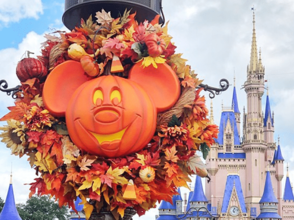 Halloween wreath with Cinderella Castle in the background, in Magic Kingdom.