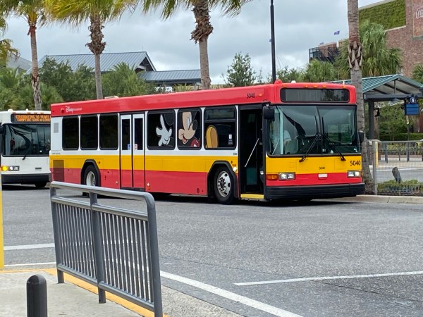 A Disney Shuttle wrapped with a giant photo of Mickey Mouse