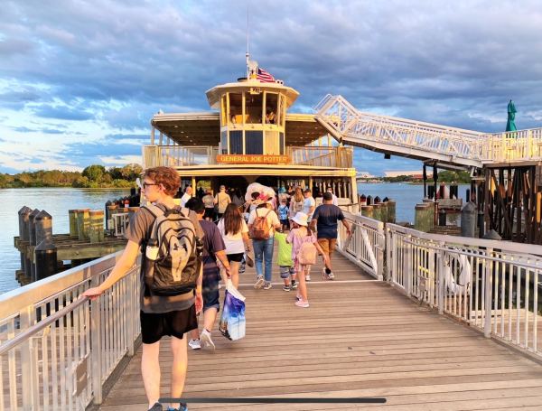 Stepping aboard the General Joe Potter Ferry Boat at Disney's Magic Kingdom. 