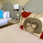 A photo of 2 beds in Disney's Contemporary Resort, decorated to the movie, The Incredibles