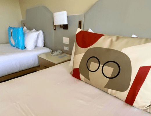 A photo of 2 beds in Disney's Contemporary Resort, decorated to the movie, The Incredibles