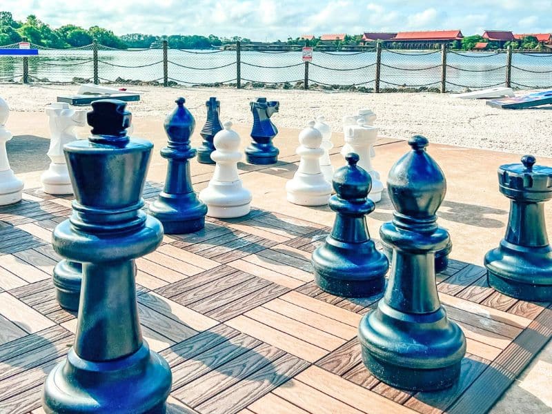 Giant chess pieces overlooking Seven Seas Lagoon and Polynesian Village Resort in Walt Disney World