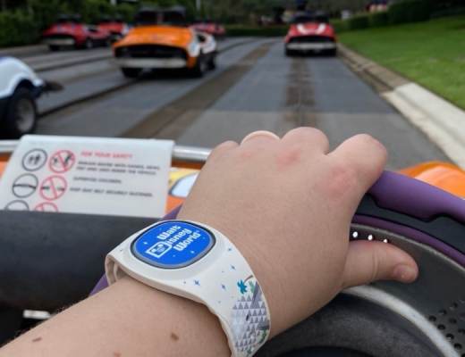 Riding on the Tomorrowland Speedway wearing a MagicBand