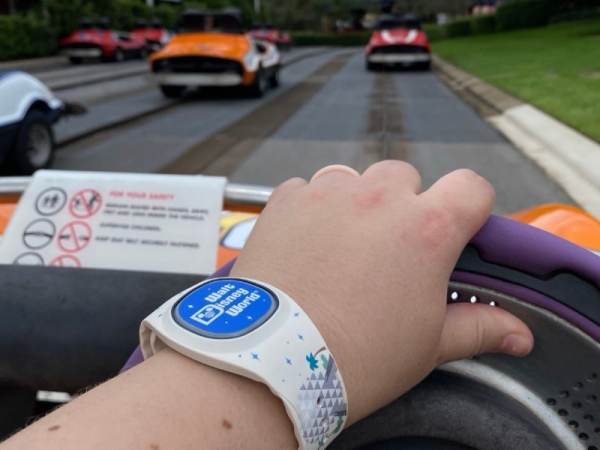Riding on the Tomorrowland Speedway wearing a MagicBand